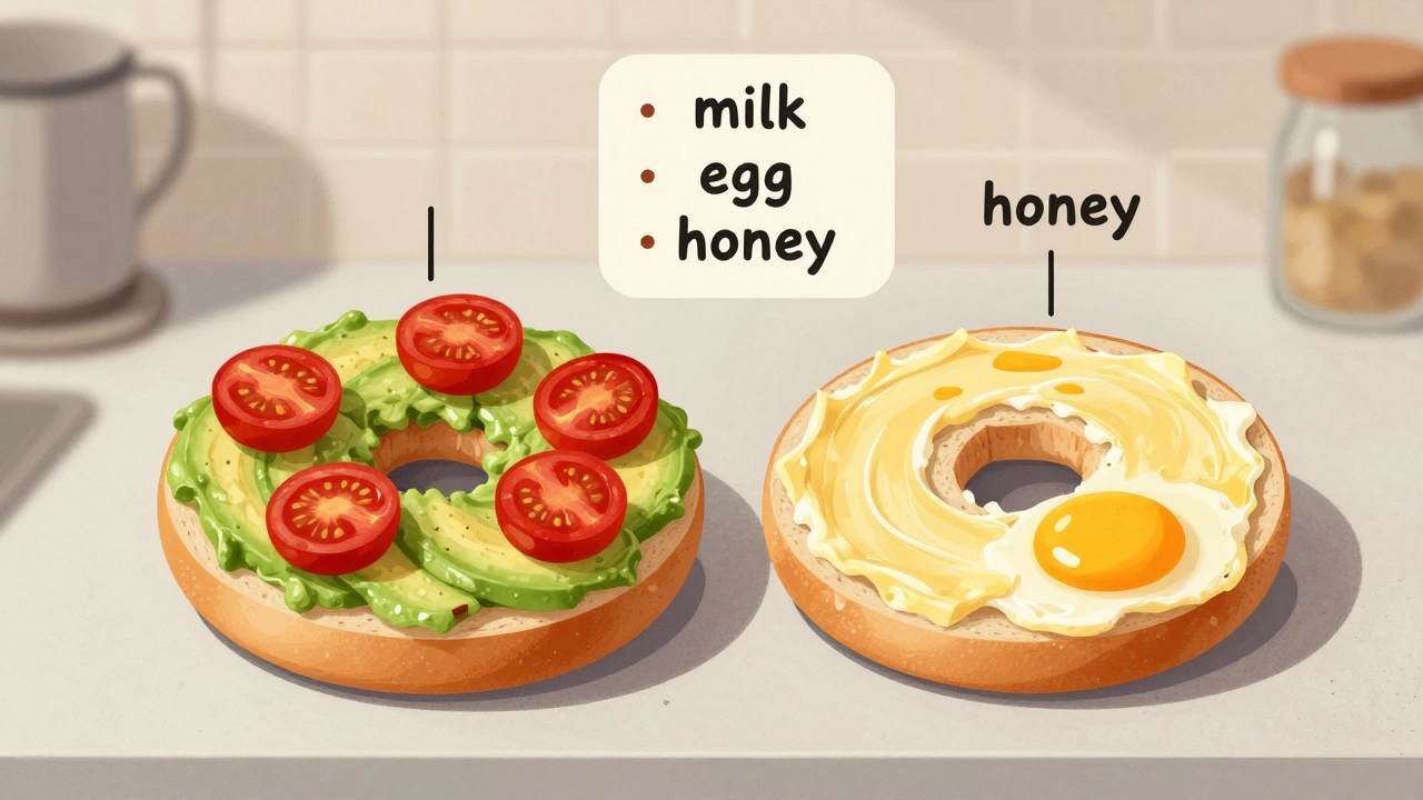 A vegan bagel with avocado spread next to a non-vegan bagel with butter and egg residue, showing ingredient differences.