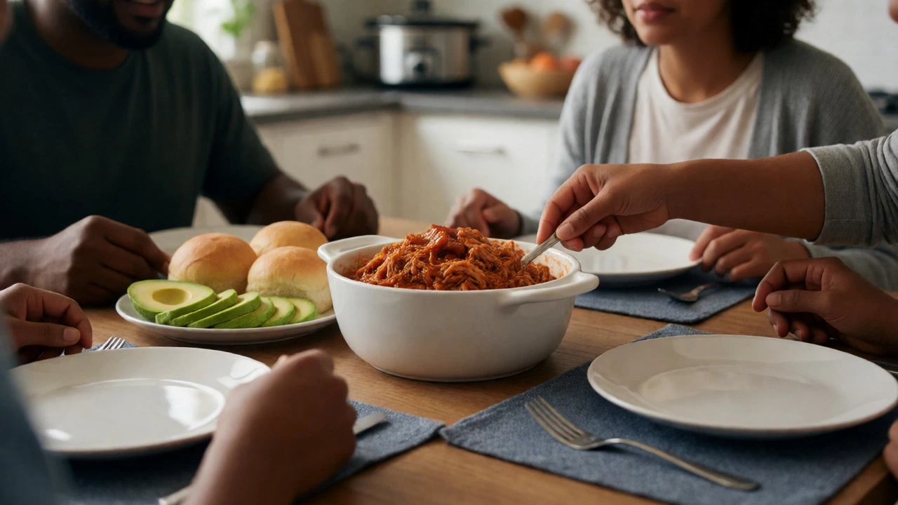 Family dining table with a bowl of shredded pulled pork and sides, ready to be served.